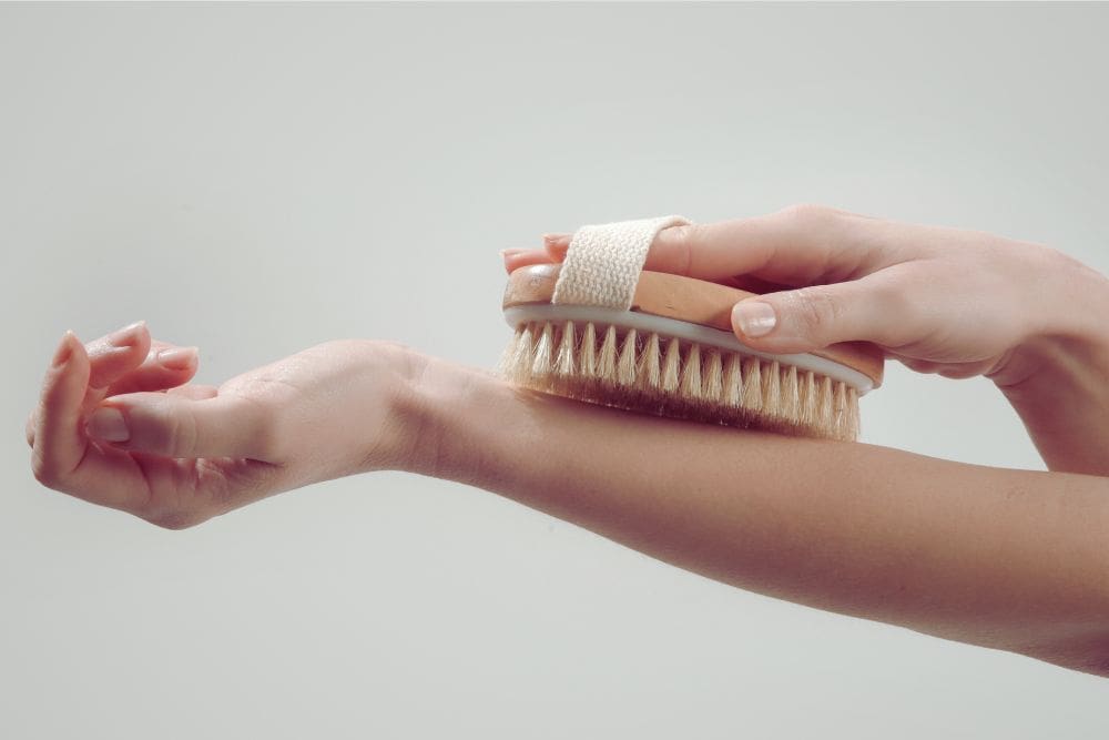 dry brushing health benefits Natural bristle brush used for dry brushing to support lymphatic flow and skin health