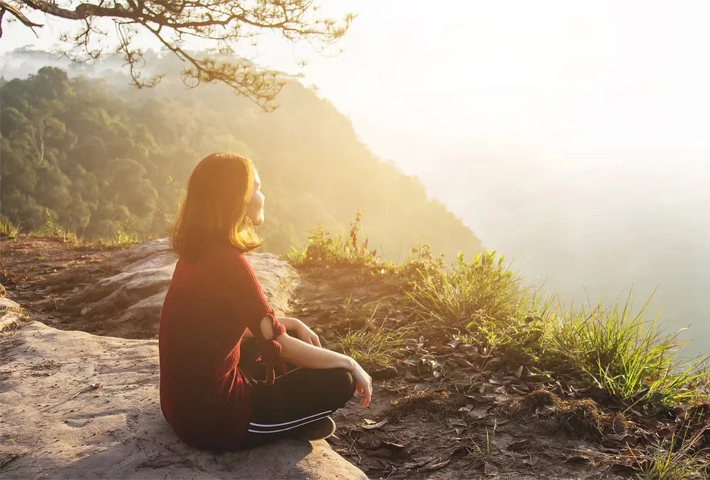 Person practicing mindful breathing to reduce stress and improve focus